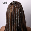 Gold rhinestone and mesh tassel headband on white background