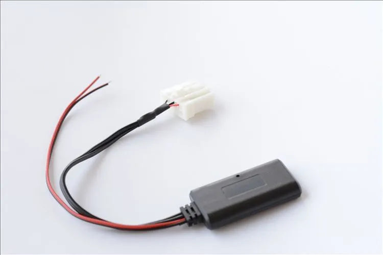 Black Mazda Bluetooth audio cable adapter for 2006 and newer 3, 6, M3, M6, MX5 models.
