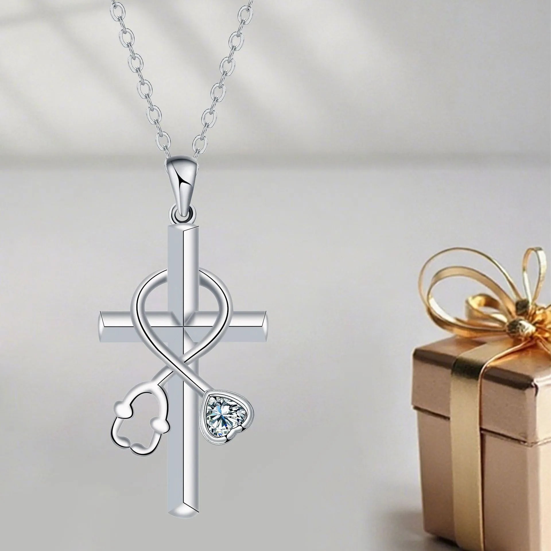 Women's copper cross stethoscope pendant necklace with electroplated finish on a cross chain.