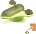 Blue interactive pet puzzle feeder toy with bell, catnip, and suction cup base on a floor.