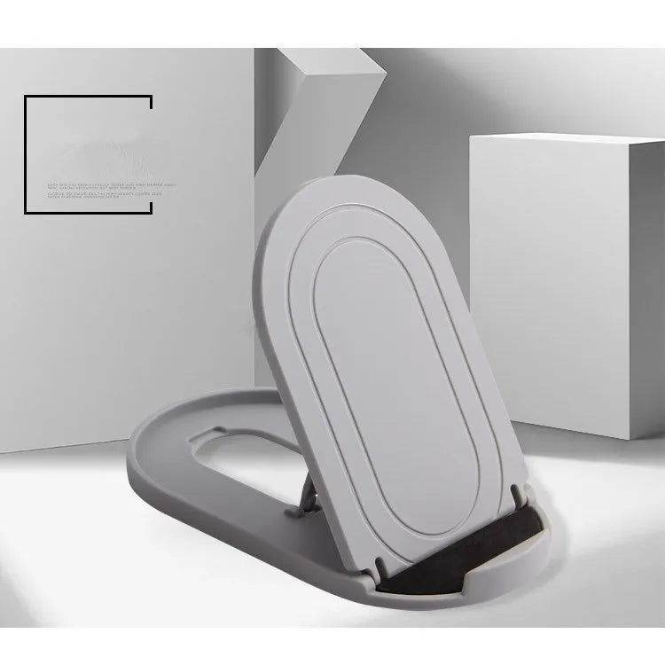 Plastic mobile phone stand with adjustable bracket in six colour options on a wooden desk