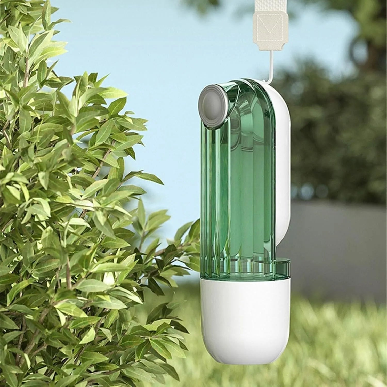 Beige foldable dog water bottle with a press-button dispenser and a small food container at the base.