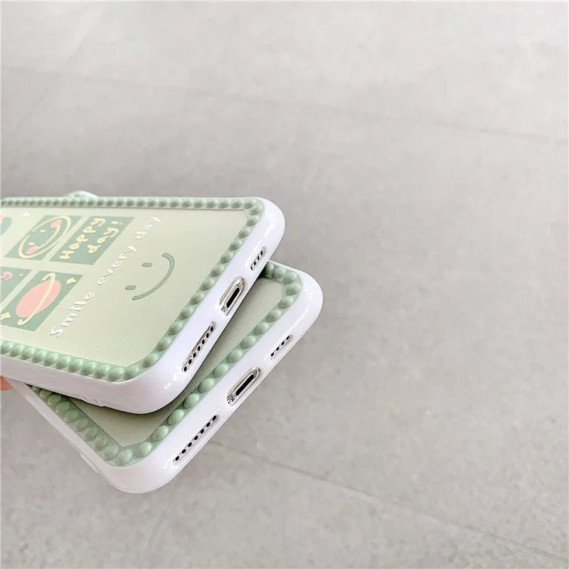 Green TPU iPhone case featuring a geometric smiley face and polka dot frame design.