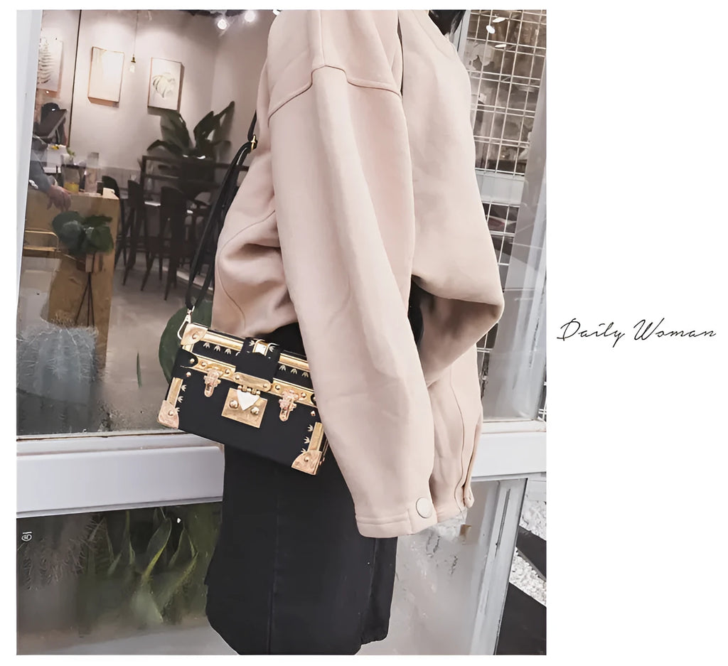 Women's black PU leather shoulder bag with flap closure and decorative rivets