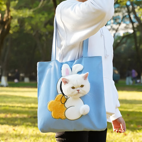 Soft canvas pet shoulder bag with cartoon pattern, shown in Light Denim colour for carrying small dogs or cats.