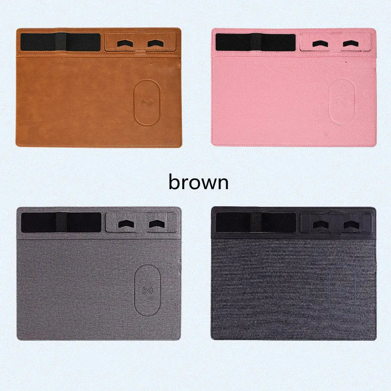 Pink wireless charging mouse pad with integrated phone holder on a desk, showing 320 x 260 mm size.