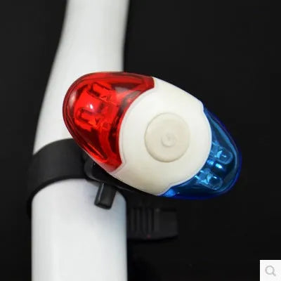 Red and blue LED bicycle tail light with adjustable mounting base shown in horizontal position.