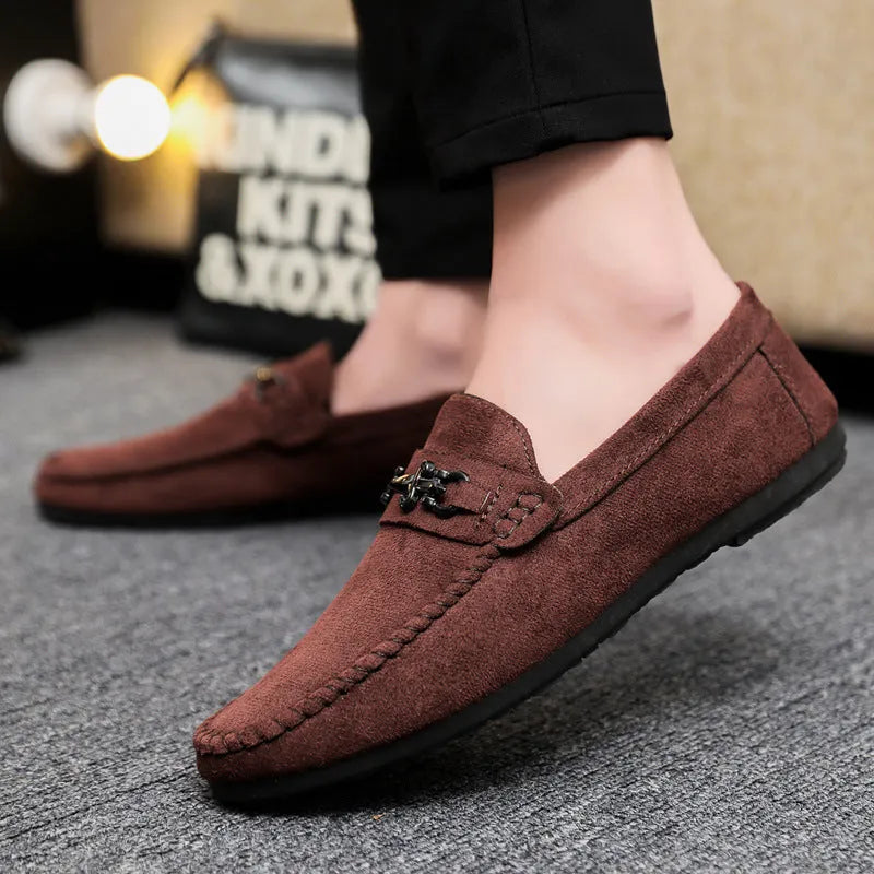 Men's waterproof black slip-on loafers with round toe and low stiletto heel on a rubber sole.