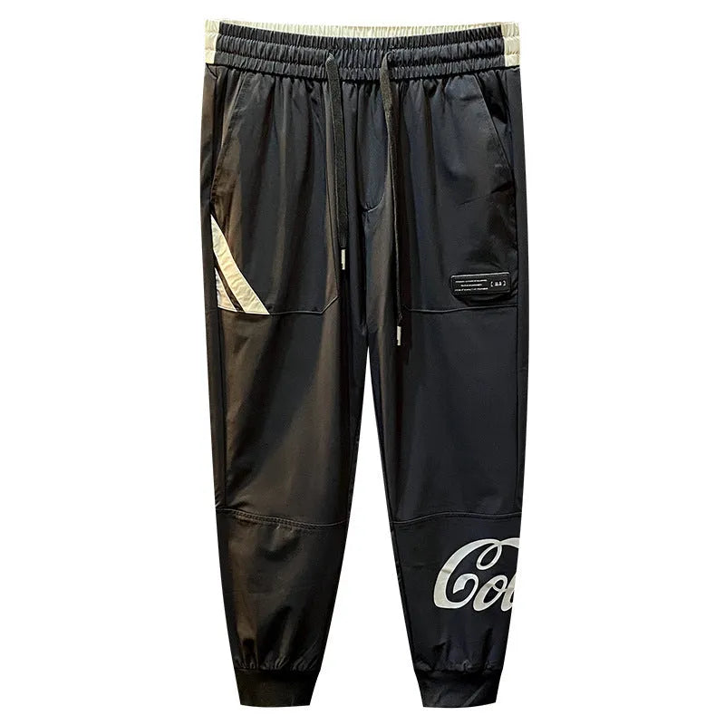 Men's solid black cotton cropped trousers with ankle banded style on hanger