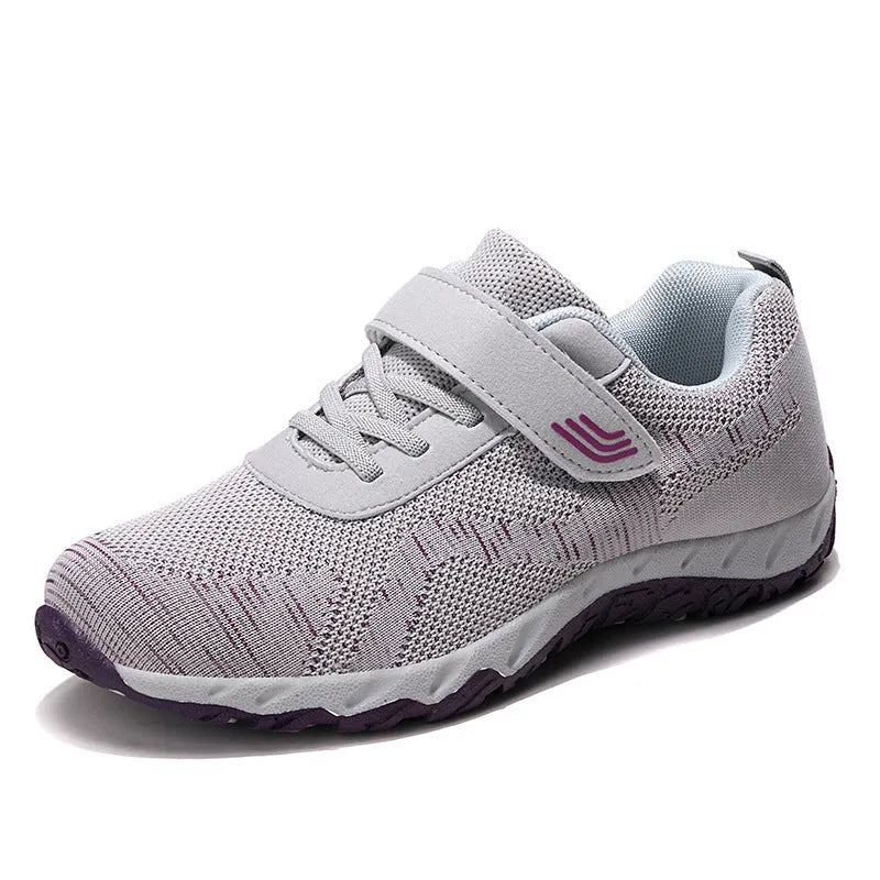 Women's low-top wedge sneaker in grey purple with mesh upper and Velcro strap.