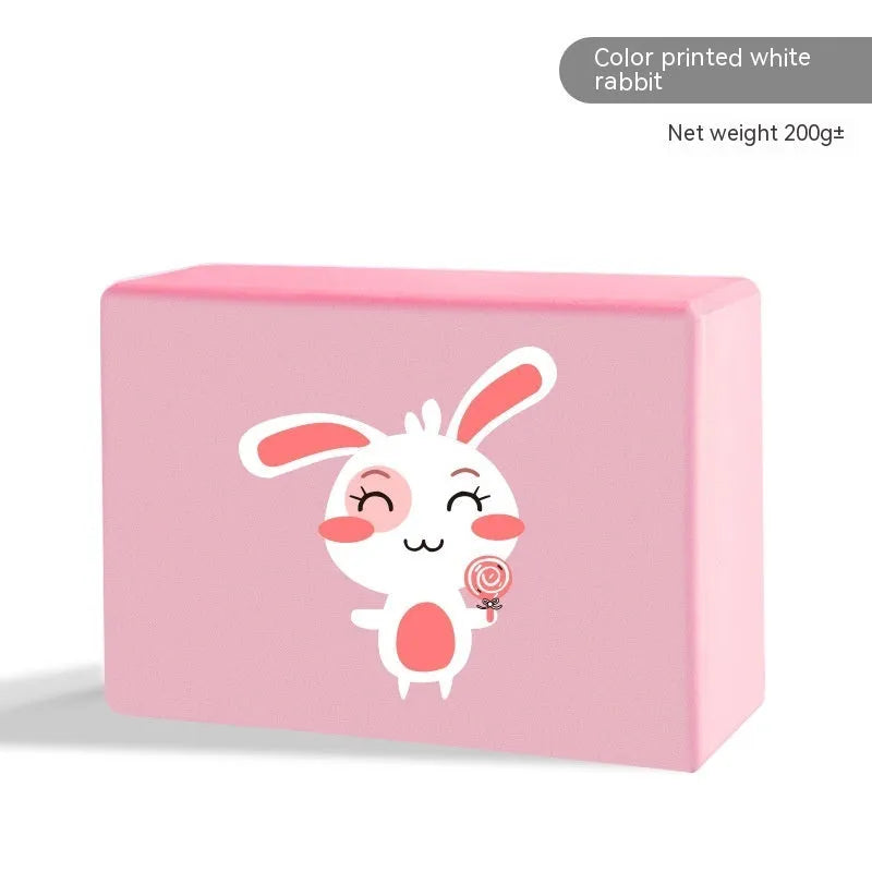 High-density EVA yoga block in pink next to a dark blue block, showing 7.5cm height and printed cartoon design options.