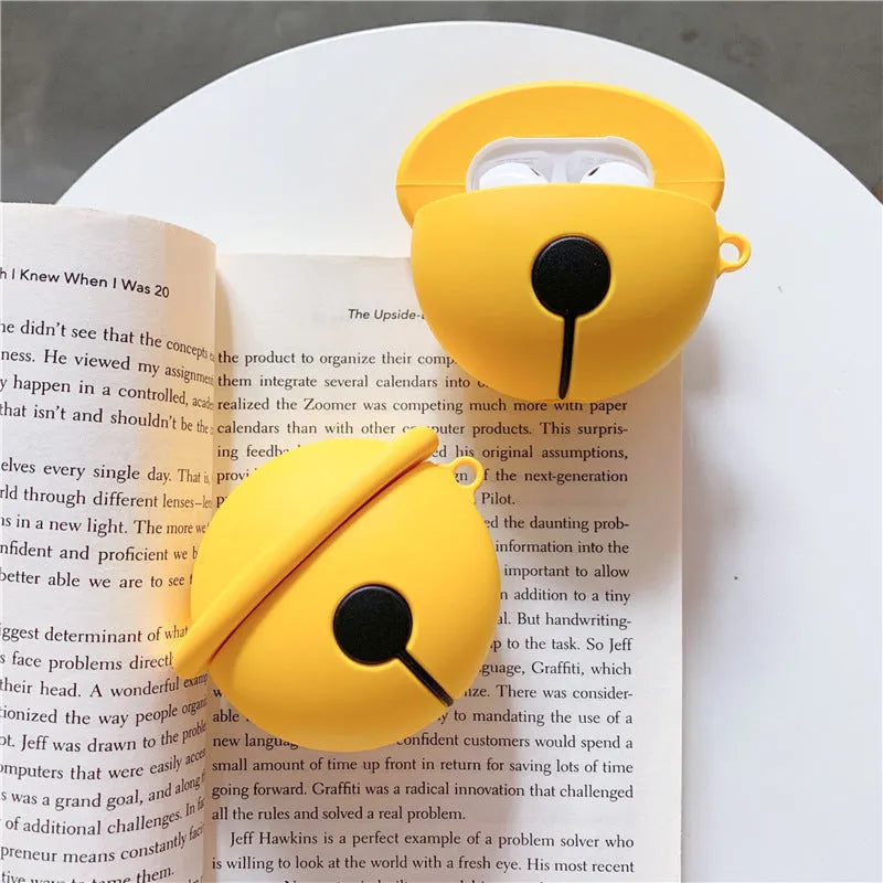 Yellow bell-shaped silicone protective case for Apple AirPods 1 and 2 headphones.