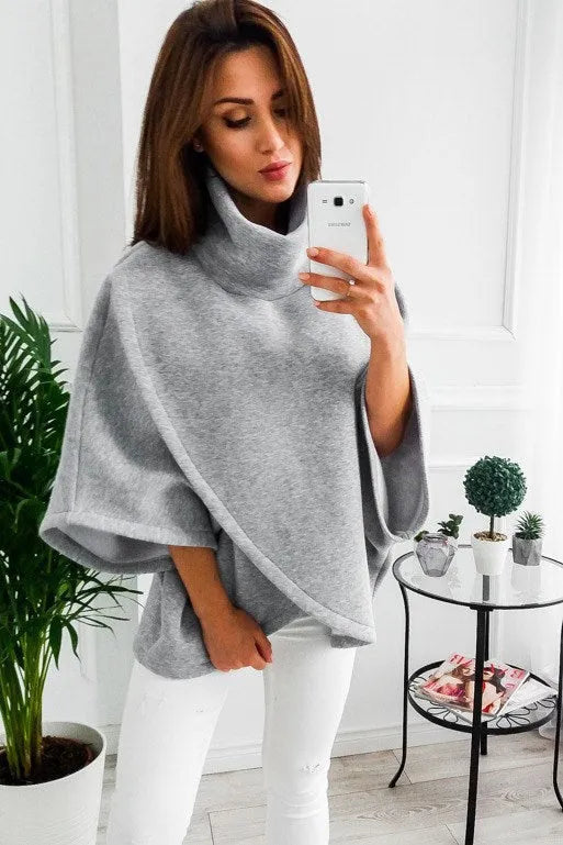 Women's longline batwing sleeve cardigan in a fleece-lined cotton blend, shown with three-button front and contrast stitching.