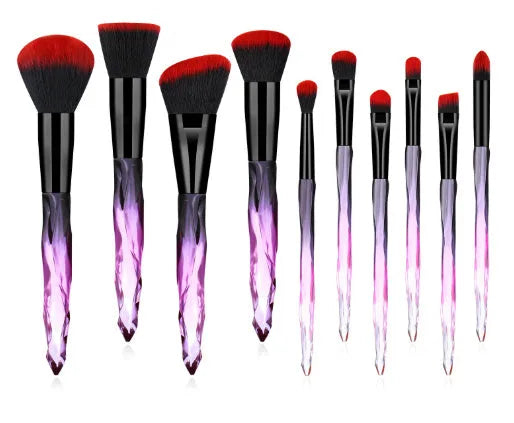 Set of 10 crystal-handled foundation brushes with synthetic bristles laid out flat.