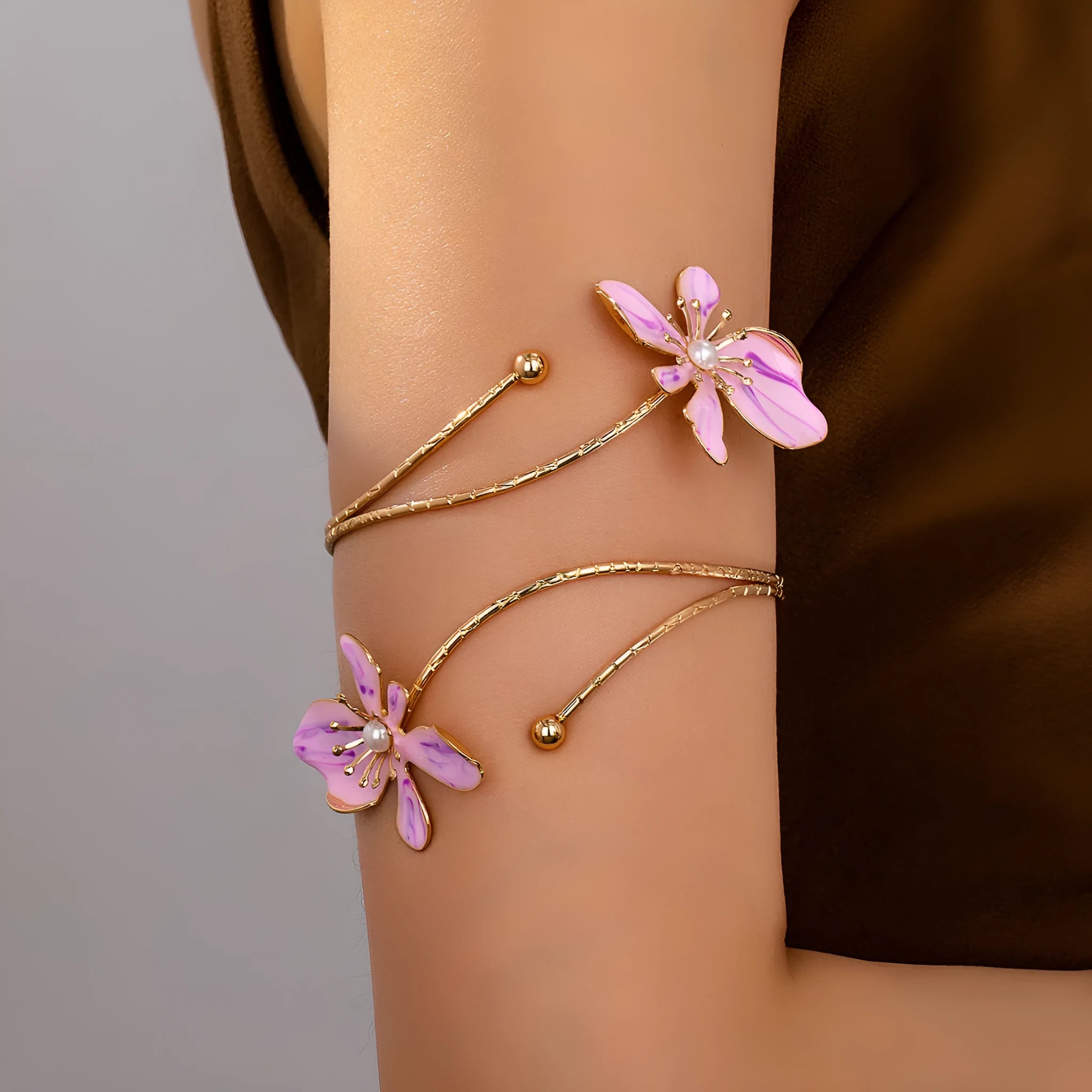 Patterned hollow armband bracelet with linear design in pink and purple colour options