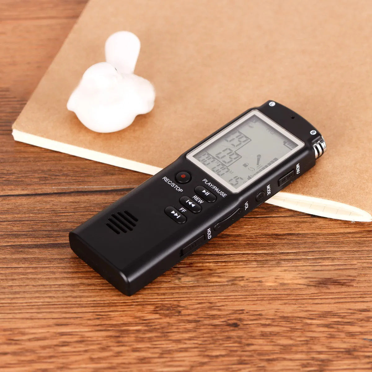 Compact black USB digital voice recorder with display screen and microphone port