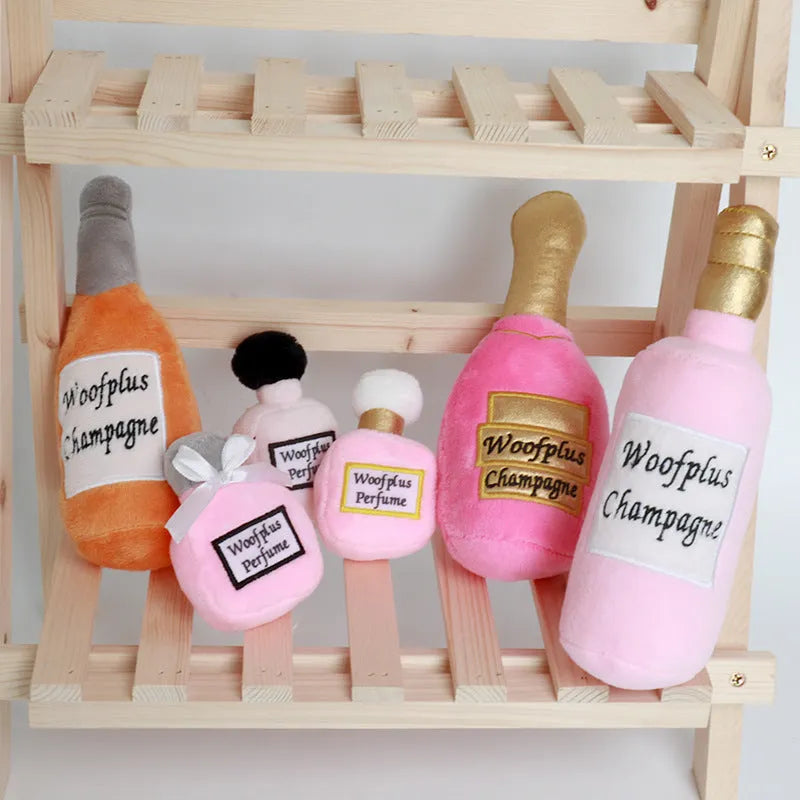 Plush wine bottle shaped dog toy in assorted colours including green, orange, red, black, coffee and white