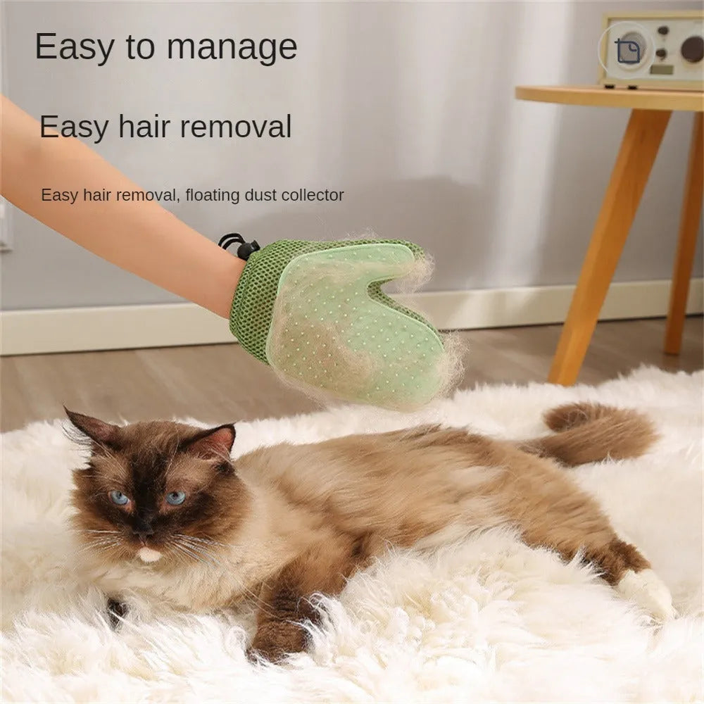 Dark blue mesh and TPR pet grooming glove for removing dog and cat hair from fur and fabrics.
