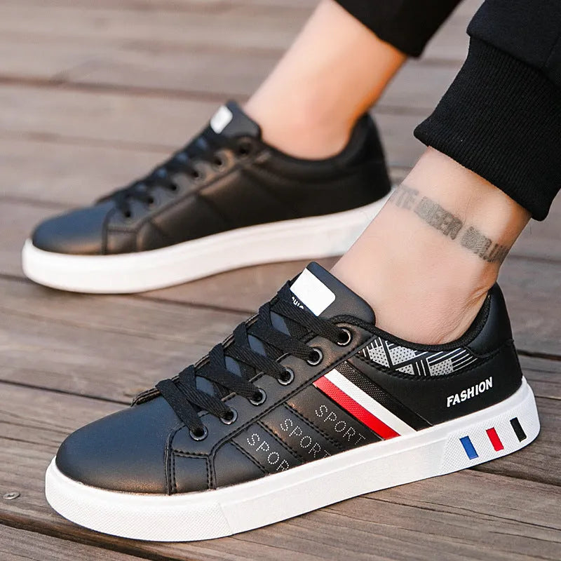 A pair of neutral-coloured sports shoes on a white background, shown in black, grey and white colour options.