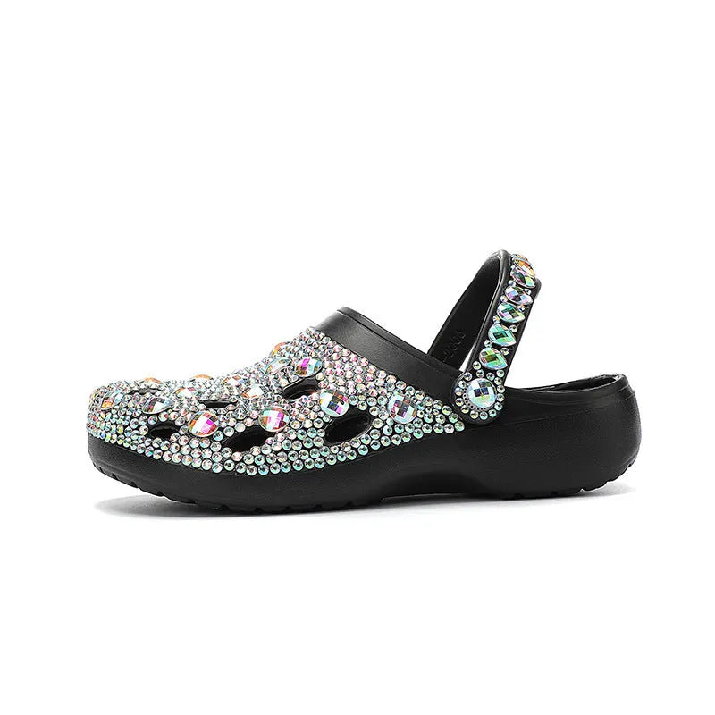 Black women's platform sandals with a hole design and rhinestone details on a lightweight EVA sole.