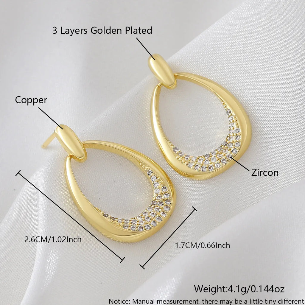 Yellow gold geometric drop earrings for women with a simple ring-style design.
