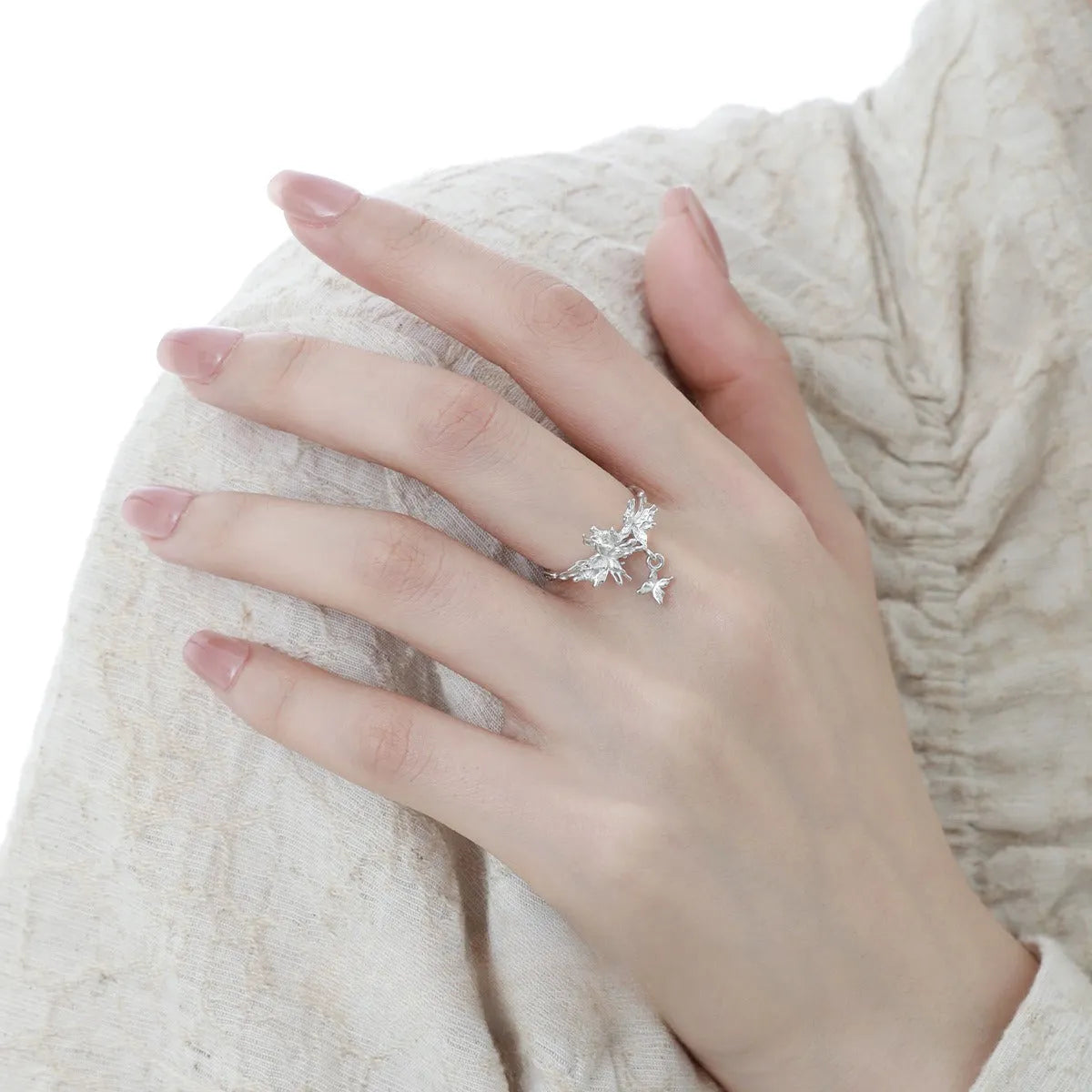Silver butterfly ring with adjustable opening in white gold or 18K gold colour tone.