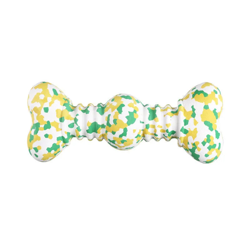 Green and white camouflage pattern natural rubber dog chew toy for large dogs on a wooden floor.