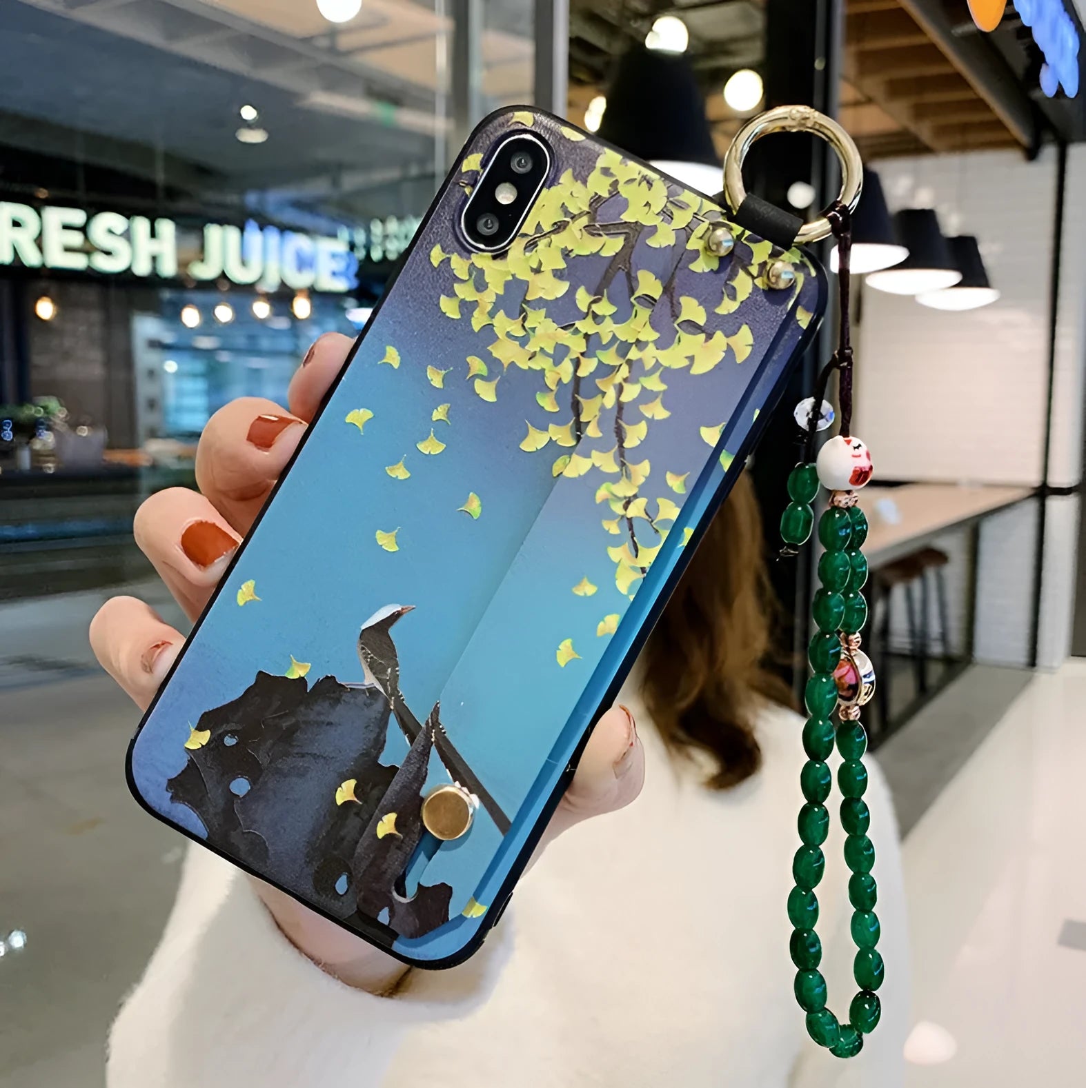 Rose floral patterned phone case with a wrist strap attachment point for iPhone.