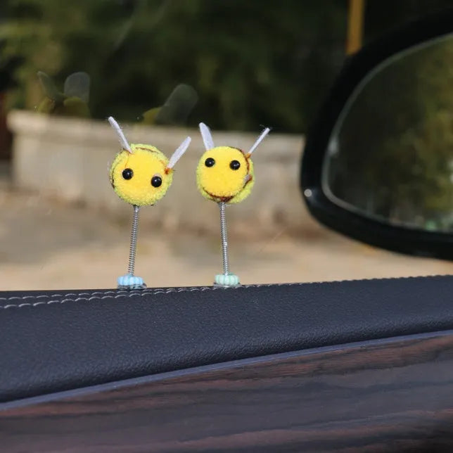 Swing spring bee car decoration made from a fur ball, measuring 3cm by 3cm.