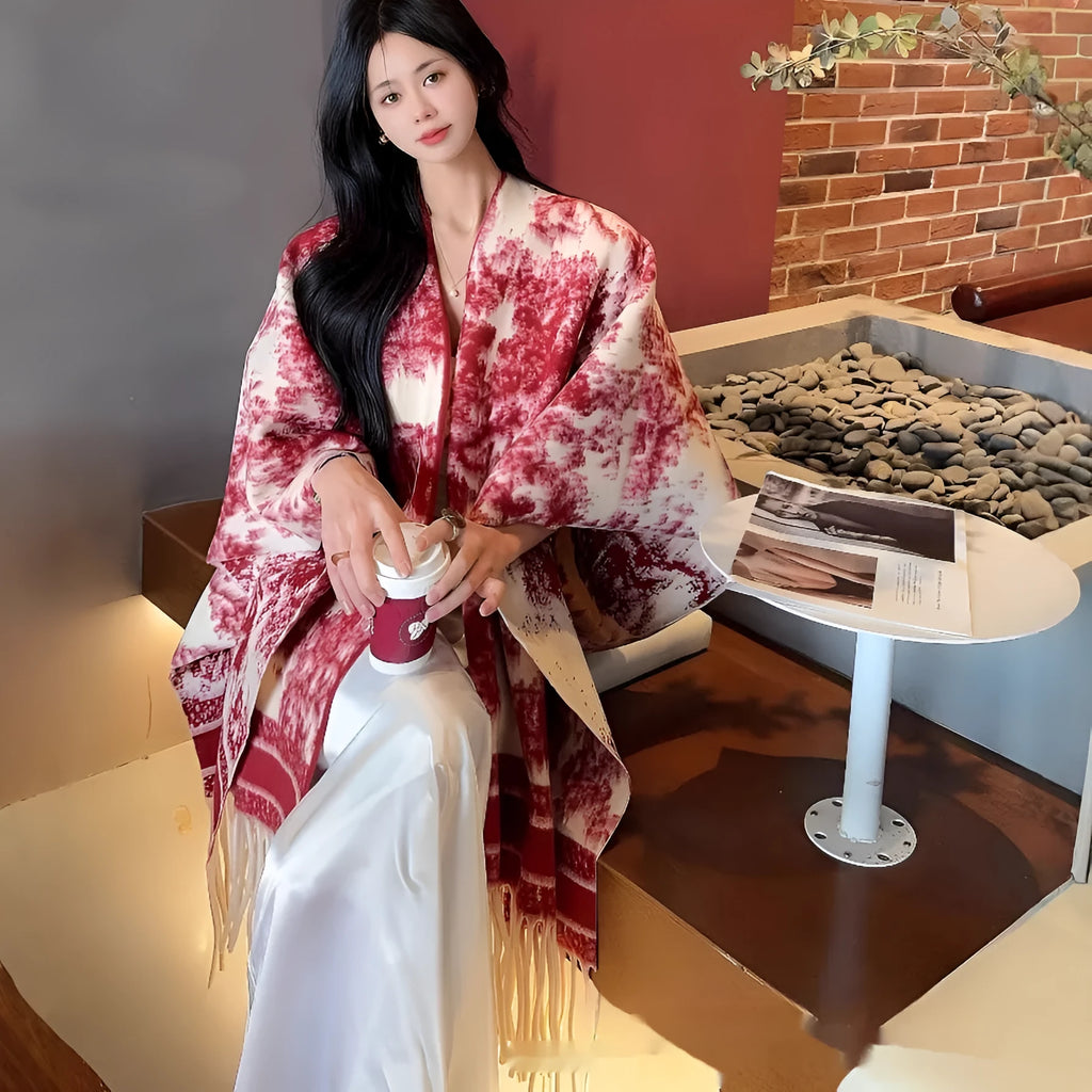 Women's polyester scarf cape with long fringed tassels, shown in a selection of available colours.
