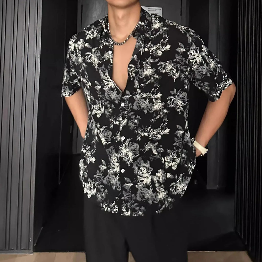 Loose casual short sleeve shirt with floral printed pattern and V-neck design in white colour