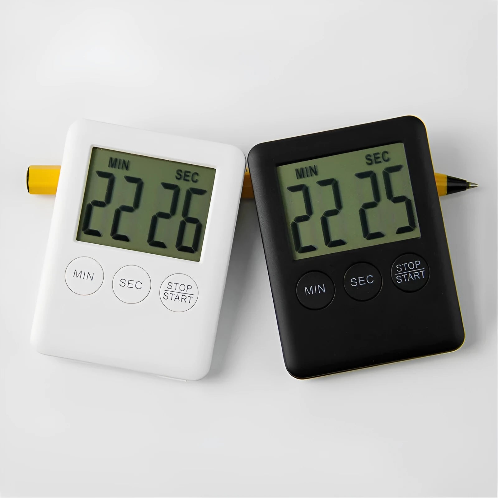 Black and white kitchen timer with magnetic back showing count-up and countdown display