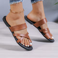 Pair of simple solid colour beach slippers with a one-line design and round toe.