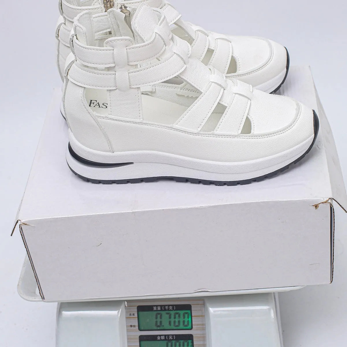 Women's black close-toed platform sandals with Velcro strap and hollow-out design.