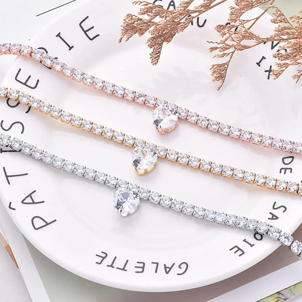 Gold rhinestone heart design pet collar for cats and dogs on a white background.