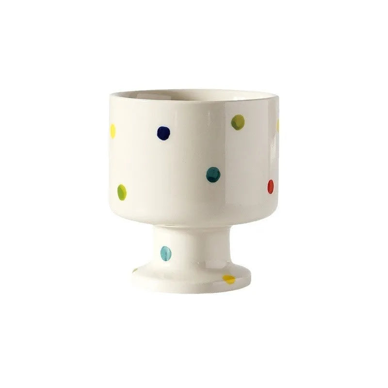 Handmade ceramic mug with irregular shape in solid colour