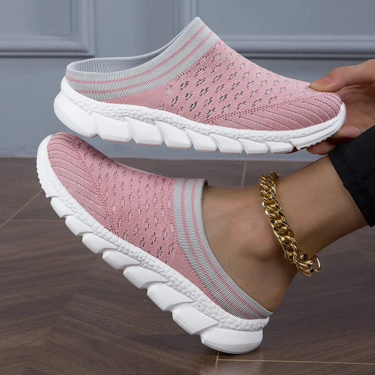 Women's striped Flyknit slipper shoes in black, pink, or purple with hollowed-out sewing line details