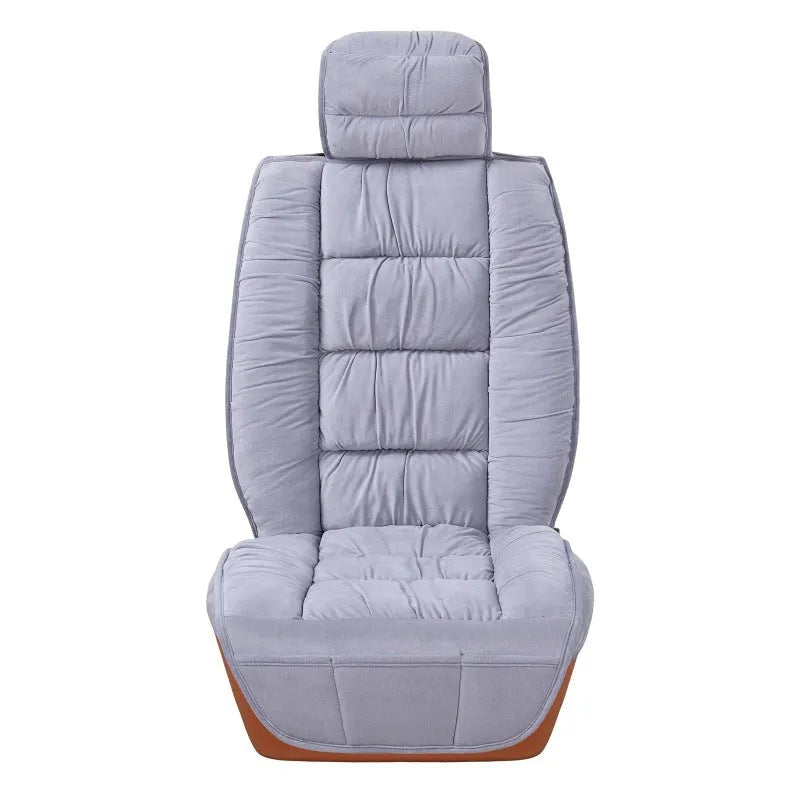 Short plush car seat cushion in charcoal grey on vehicle seat