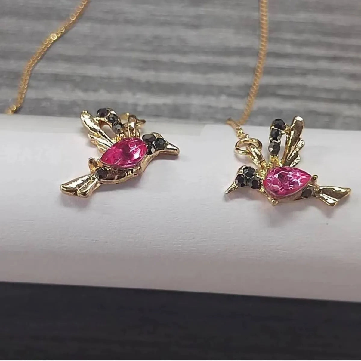 Bird hanging earrings with zirconium wings in long drop style