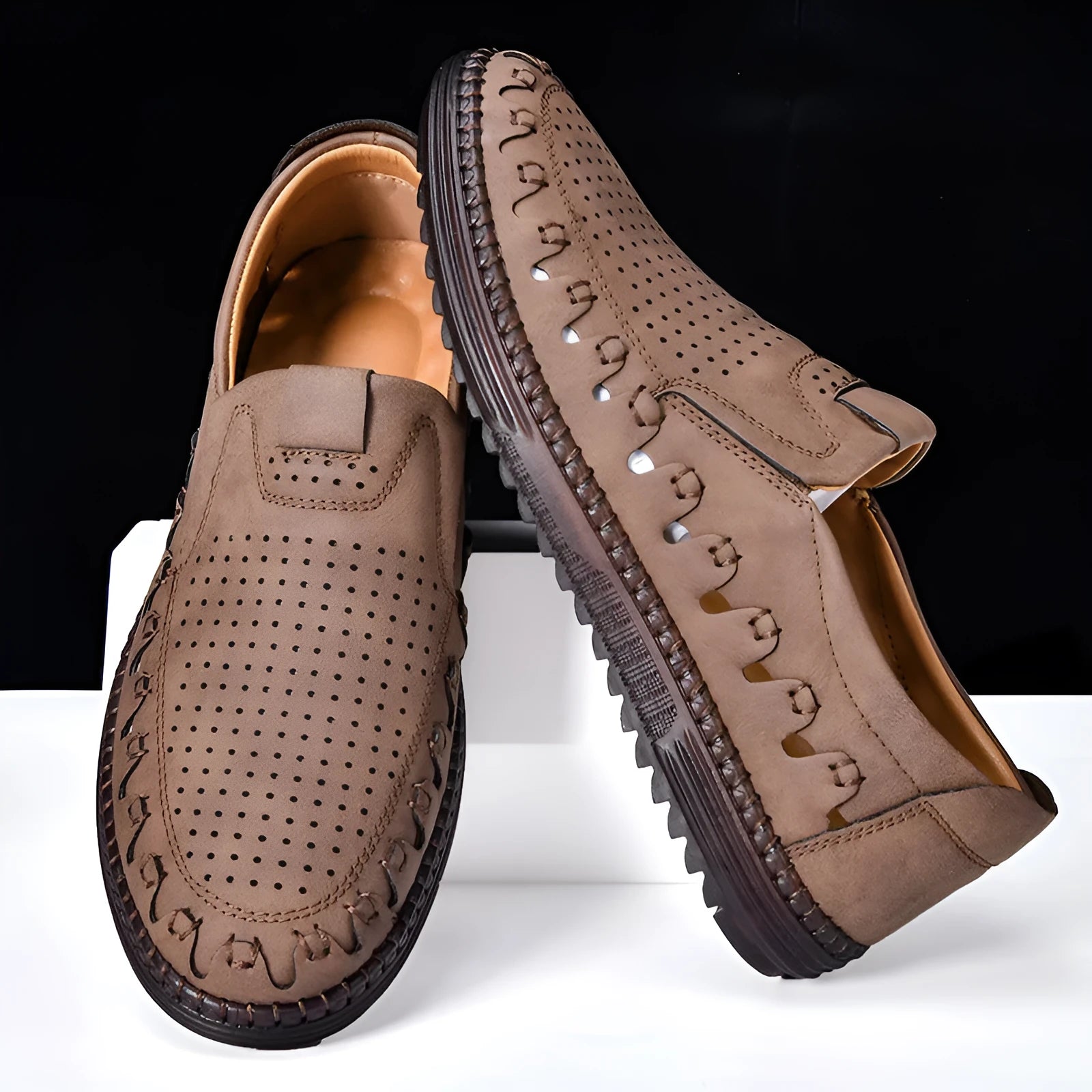 Men's brown slip-on casual shoes with artificial PU upper and visible sewing construction around PVC sole