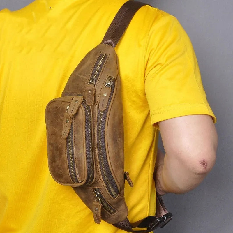 Dark crazy horse cowhide leather messenger bag showing front flap and adjustable shoulder strap.