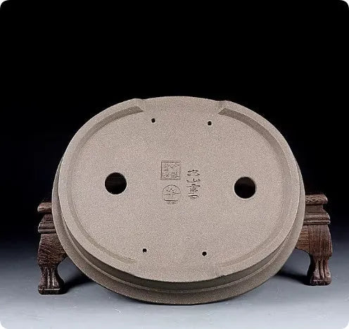 Handmade antique oval bonsai flower pot in purple sand for succulent plants.