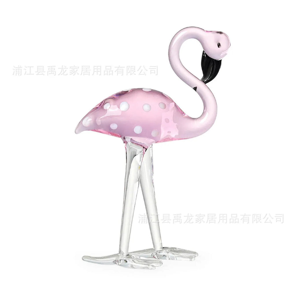 Pink crystal flamingo decorative sculpture on table with modern minimalist design