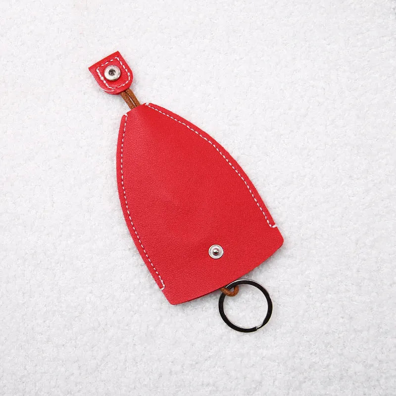 Cartoon design pull-out car key case made from soft PU leather, showing approximate size.