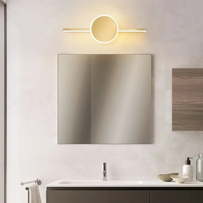 Modern wall-mounted bathroom mirror cabinet with integrated LED makeup lights around the edge.