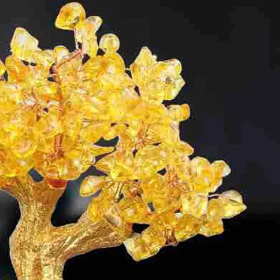 Citrine-coloured Chinese style resin turtle money tree ornament on display.