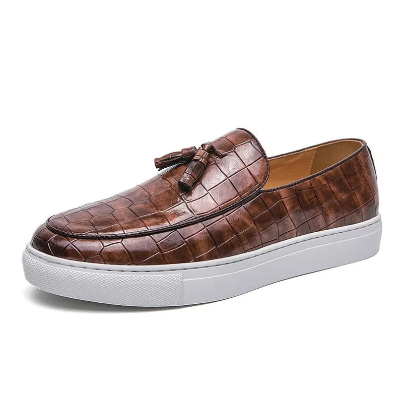 Men's black faux leather sneakers with a tassel detail on the upper, shown on a white background.