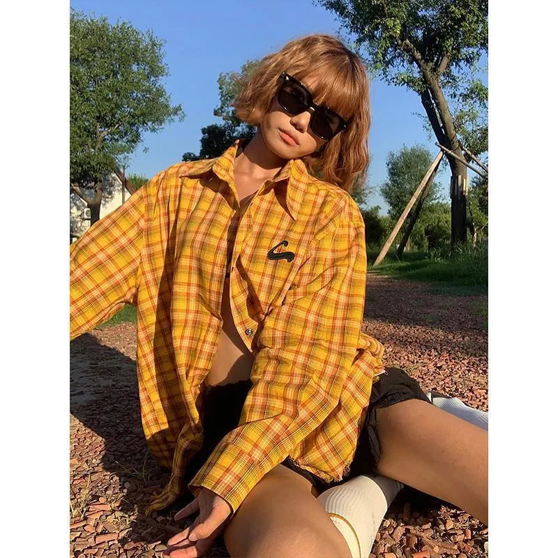 Dopamine yellow plaid shirt on a hanger, showing loose cardigan-style fit.
