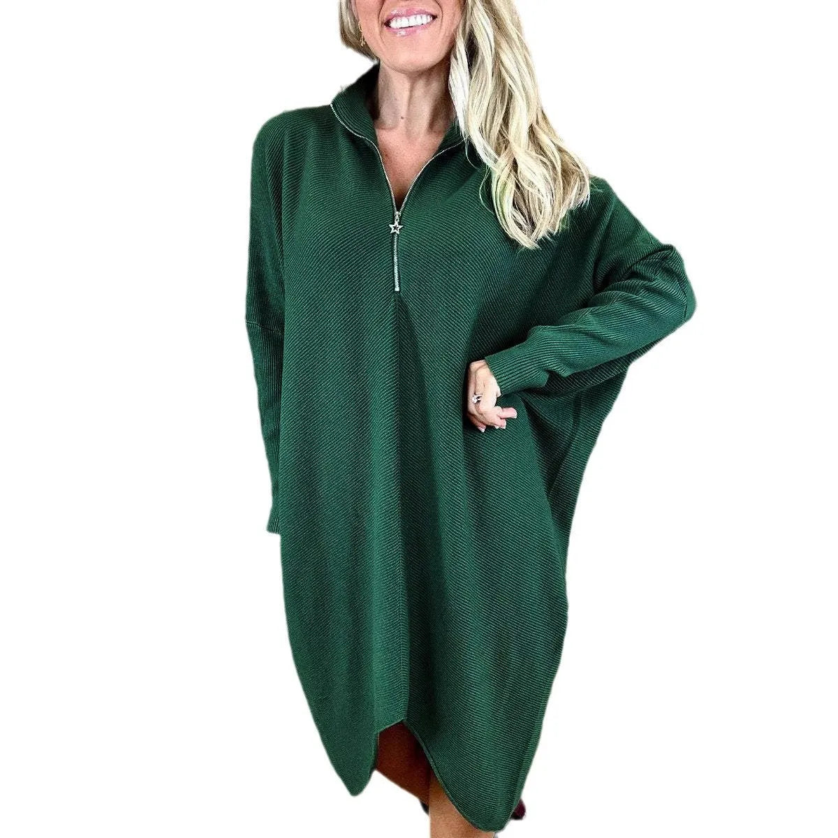 Women's solid colour loose fit knitted dress with raglan sleeves on a model.