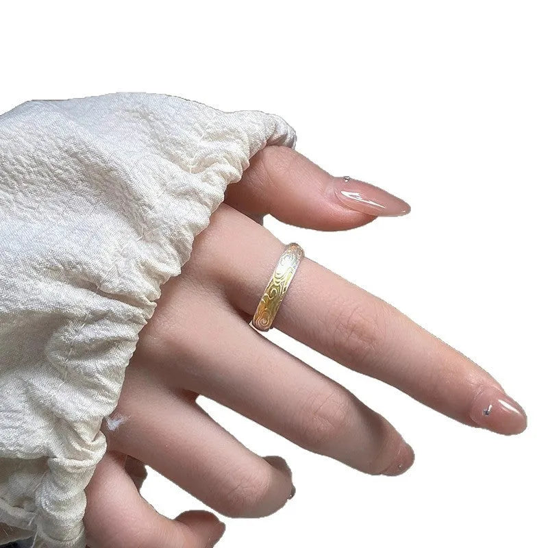 Geometric Xiangyun pattern open-mouth ring with silver and gold electroplated finish on white copper.
